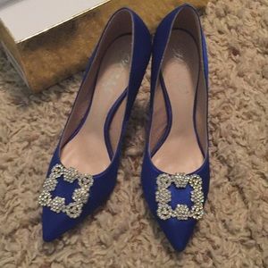 Blue satin heels with studded toe.